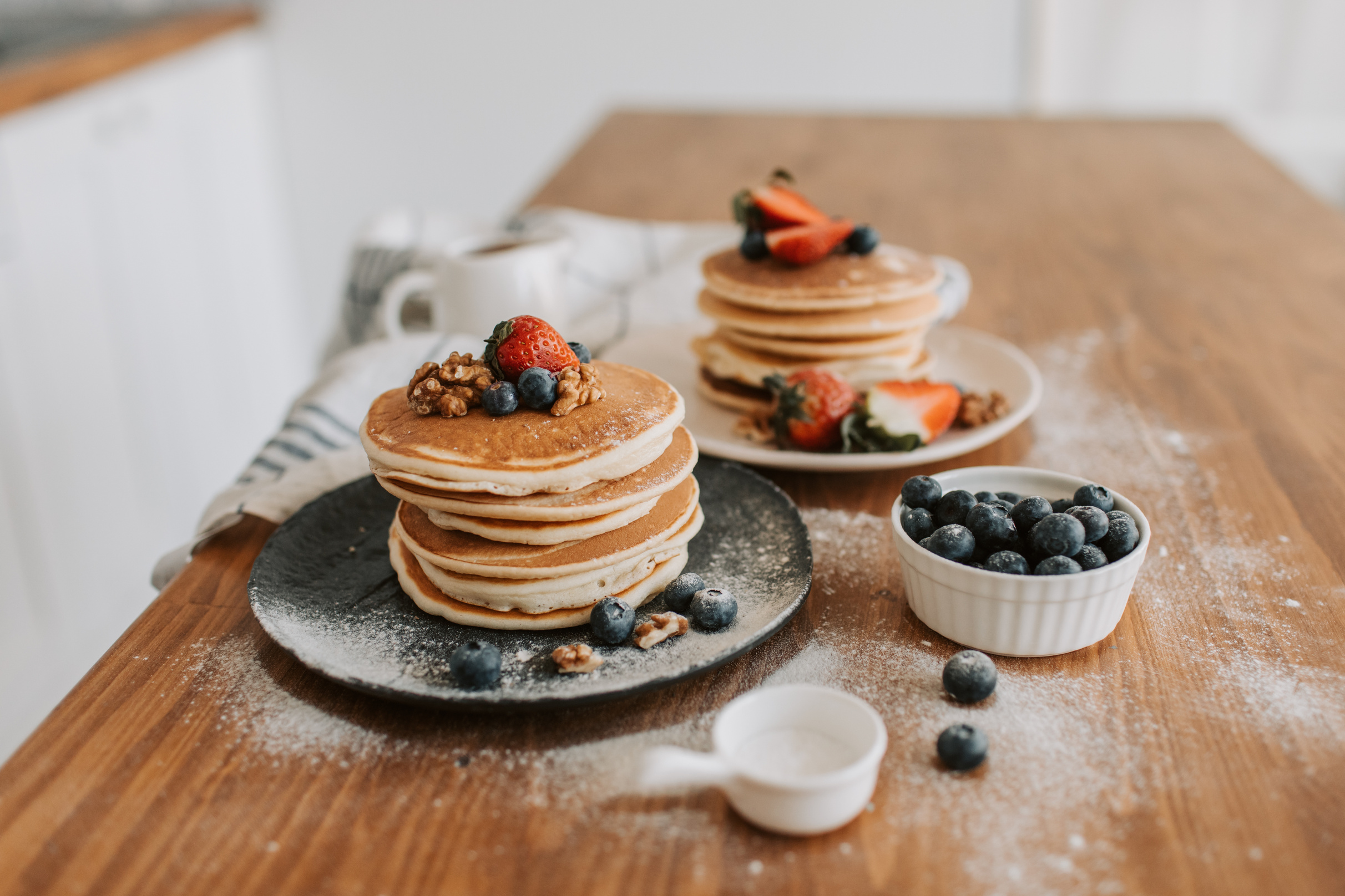 A Close-Up Shot of Pancakes with Strawberries and Blueberries